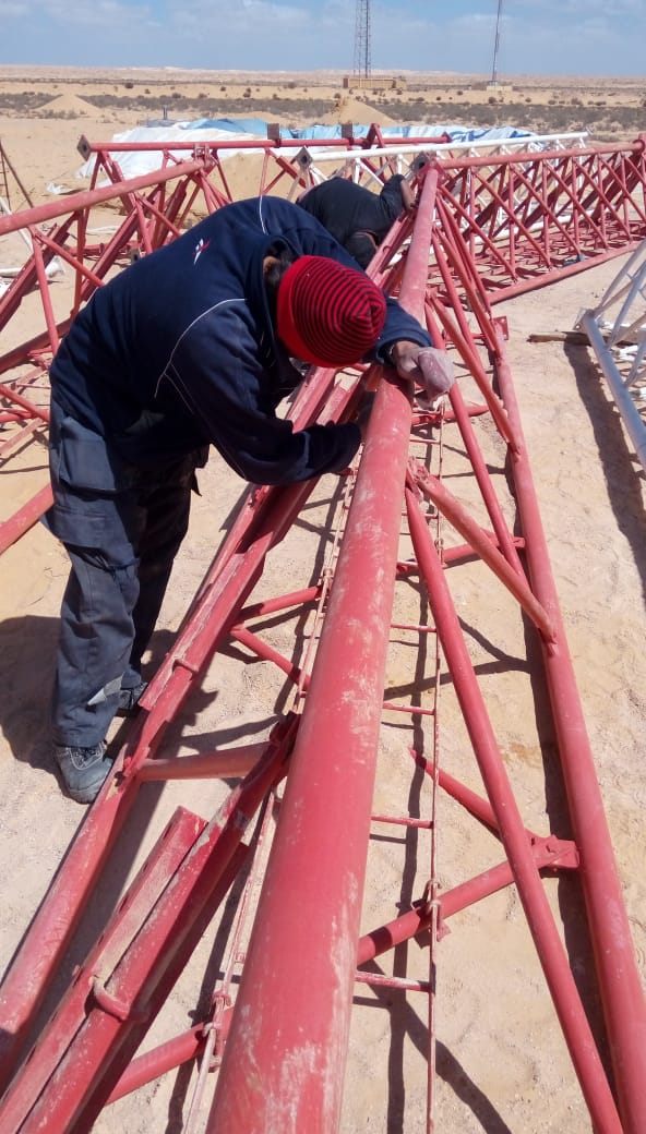 Surface preparation on a tower section.