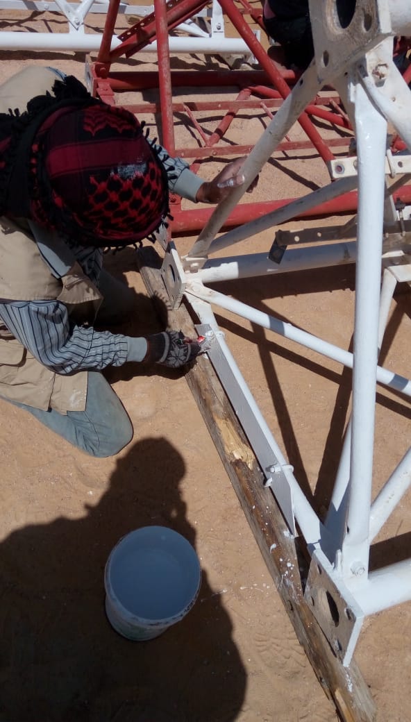 Repainting around tower bracing and connections.