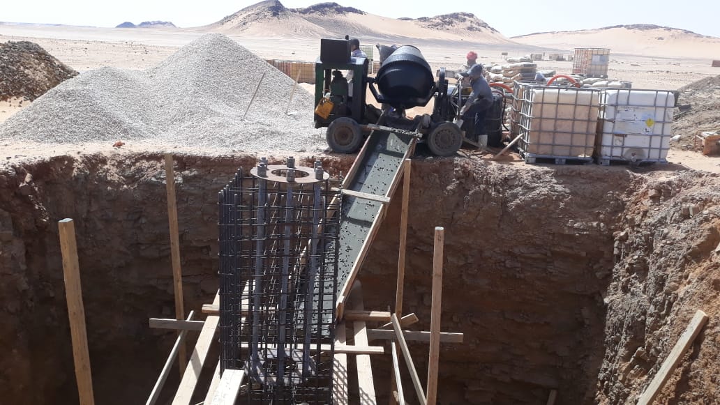 On-site concrete mixing and placement into the foundation.